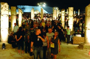 Performance-goer move through a reception areas set up like a Roman palace. Courtesy of the Israeli Opera
