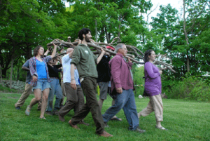 Participants in Art Kibbutz carry the 'Shema: Listen' wooden sculpture. Photograph by Paul R. Solomon.