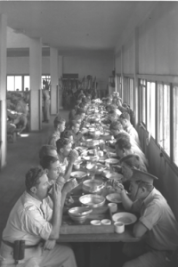 ‘The special night squad eat in the dining hall at Kibbutz Ein Harod,’ 1938. Courtesy of The Government Press Office, Israel.
