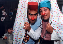 The Jester Is In Dudon, at left, and Jerome reassure young patients.