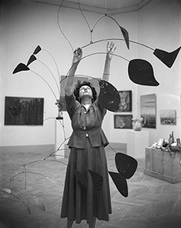 ‘Peggy Guggenheim with Alexander Calder’s Arc of Petals at the Venice Biennale,’ Venice, 1948. Peggy Guggenheim Collection Archives, Venice. Photo Archivio meraphoto Epoche. Gift, Cassa di Risparmio di Venezia, 2005.