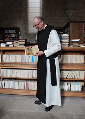 Fra Xavier Guanter, cradling the Haggadah.
